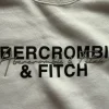 Biała krótka bluza Abercrombie & Fitch z UsA– NOWA z metką