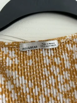 Blommig byxdress