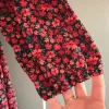 Blommig klänning storlek L