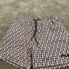 Fila badshorts med loggamönster