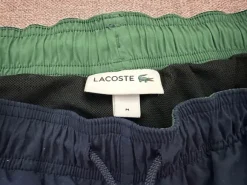 Granatowe spodenki kąpielowe Lacoste, rozmiar M