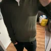Grön quarterzip i merinoull