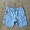 Lysegrå shorts fra H&M i str. L.