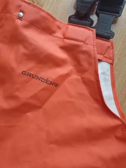 Pomarańczowe spodnie wodoodporne przeciwdeszczowe sztormiaki Grundens