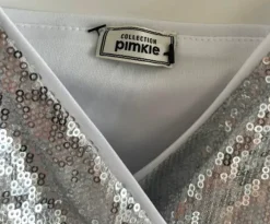 Srebrny kombinezon cekiny M kopertowy elegancki imprezowy błyszczący mini